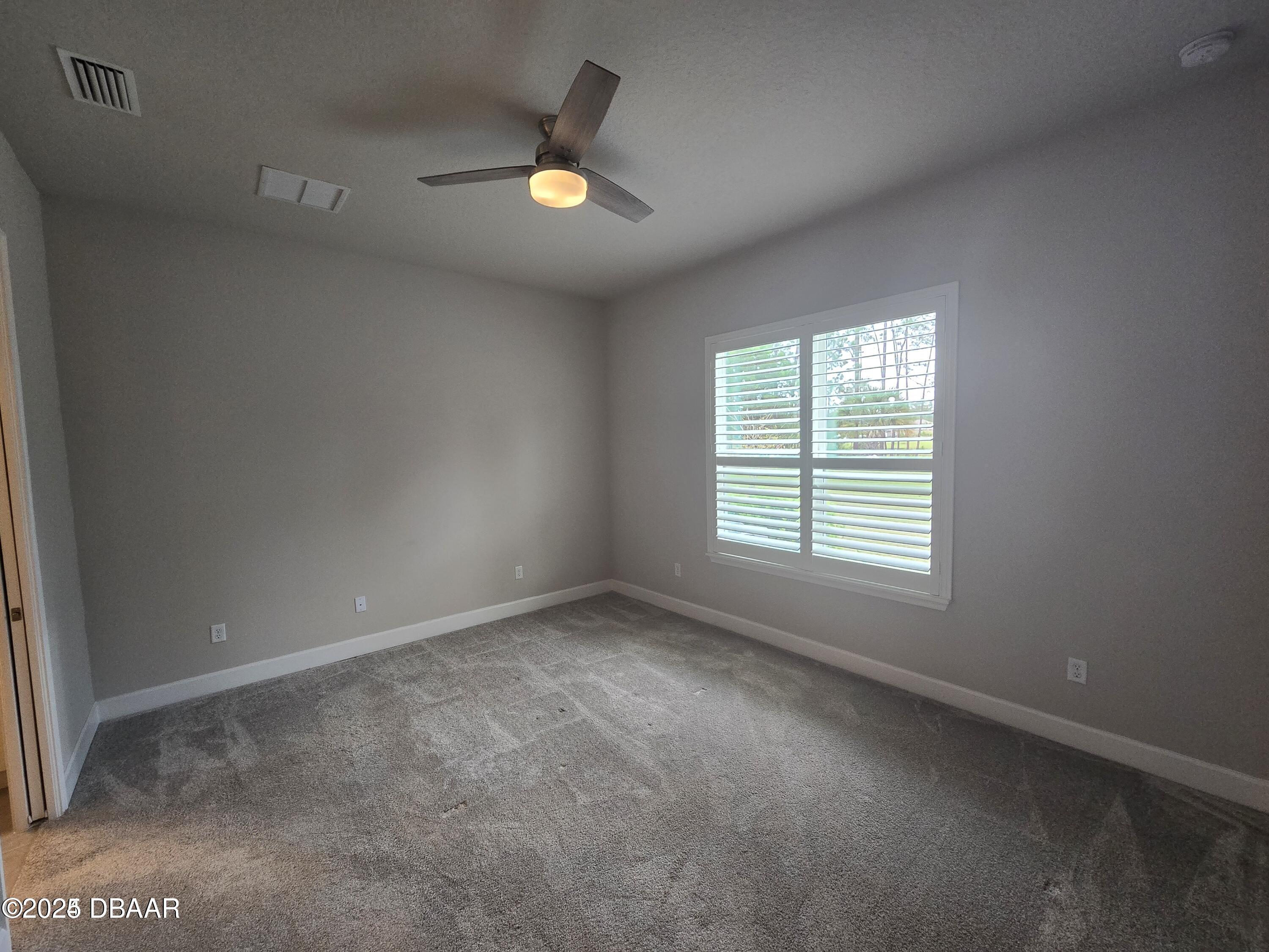 54 Longridge Lane Ormond Beach, FL 32174 - Photo 5 of 16 an empty room with window