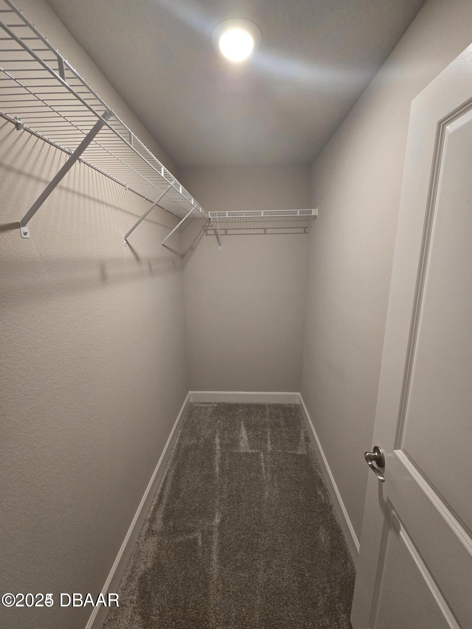 54 Longridge Lane Ormond Beach, FL 32174 - Photo 10 of 16 a view of a room with racks on the wall