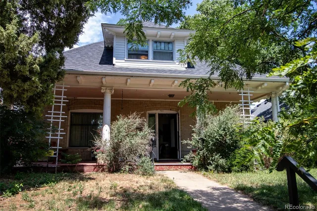 front view of house with a tree