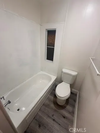 a bathroom with a toilet and a sink