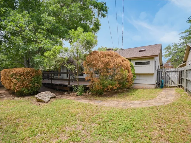 a view of a backyard with sitting area
