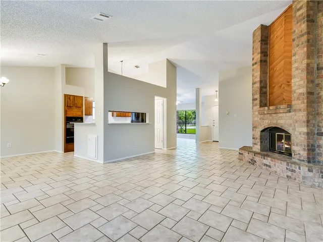 a view of a kitchen with furniture and a fireplace
