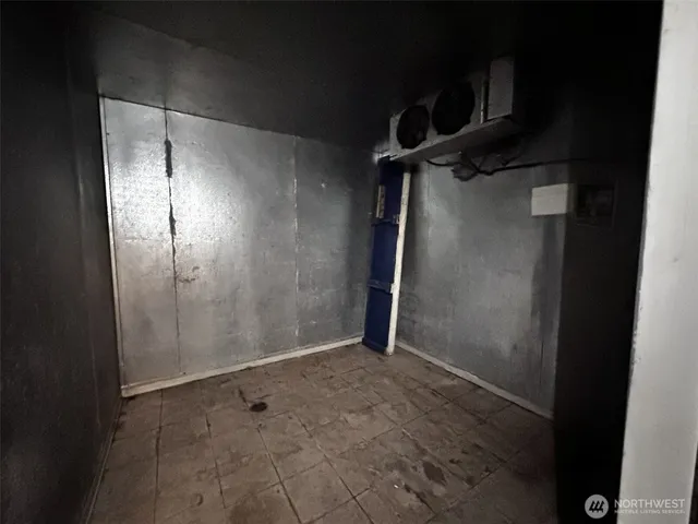 a view of bathroom with a sink and a mirror