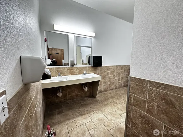 a bathroom with a toilet and a sink