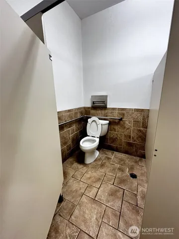 a bathroom with a double vanity sink mirror and bathtub