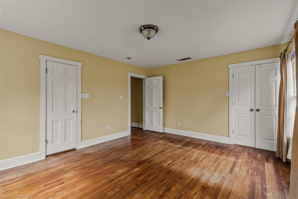 914 Griffith Avenue Terrell, TX 75160 - Photo 16 of 32 a view of an empty room with wooden floor