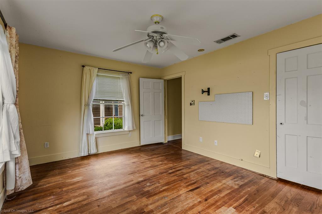 914 Griffith Avenue Terrell, TX 75160 - Photo 20 of 32 wooden floor in an empty room with a window