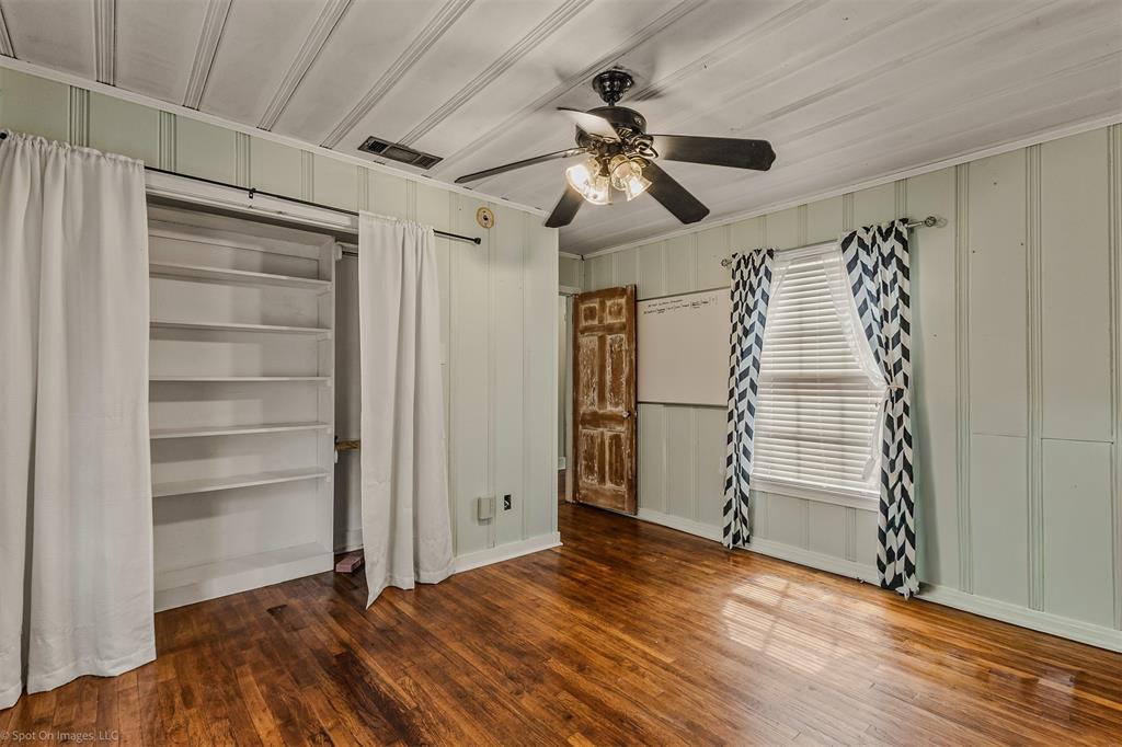914 Griffith Avenue Terrell, TX 75160 - Photo 22 of 32 a view of empty room with wooden floor and fan