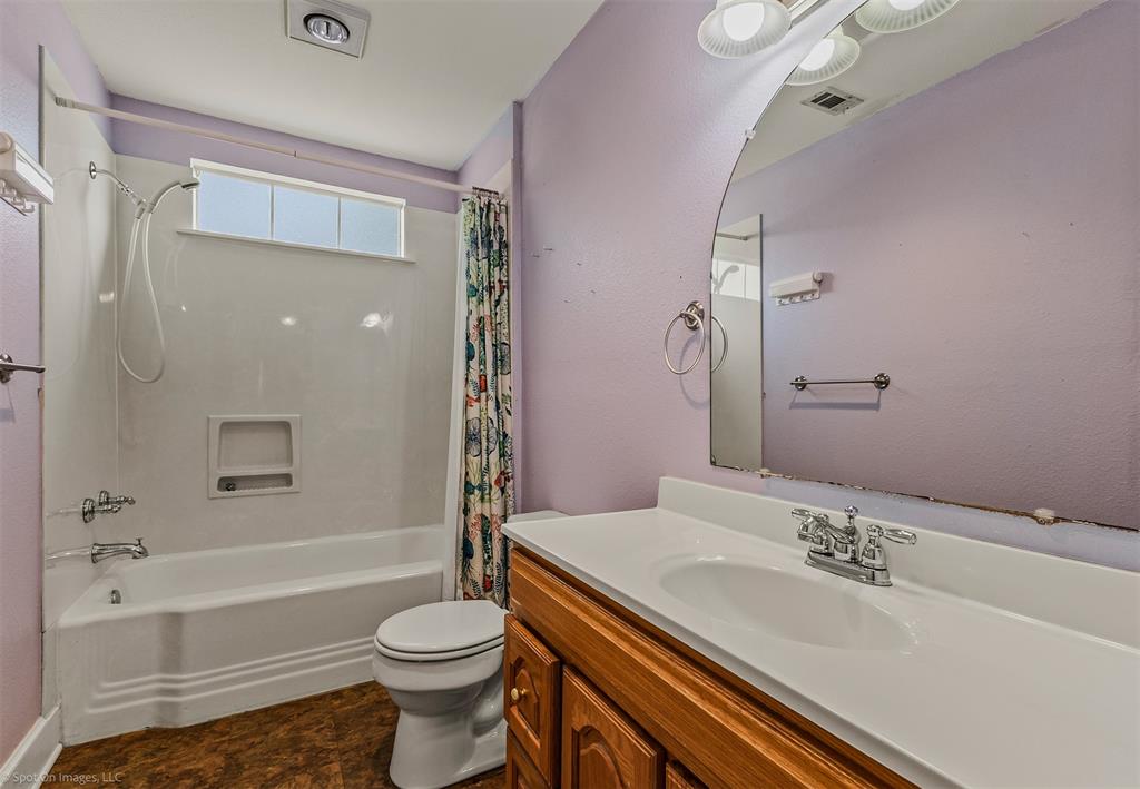 914 Griffith Avenue Terrell, TX 75160 - Photo 23 of 32 a bathroom with a sink a toilet and shower