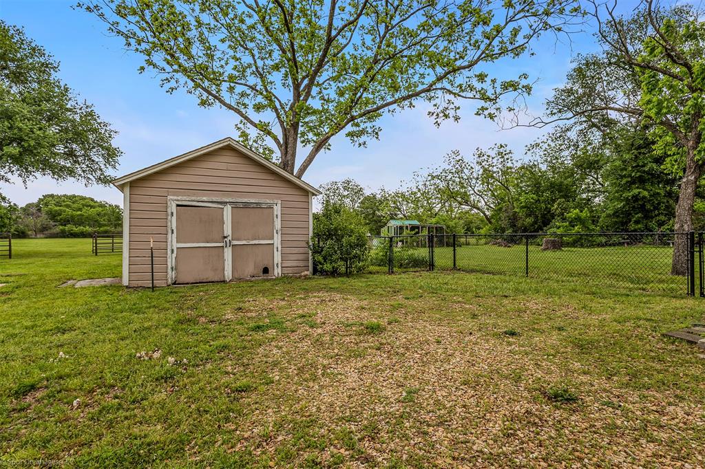 914 Griffith Avenue Terrell, TX 75160 - Photo 28 of 32 a house with a tree in front of the house