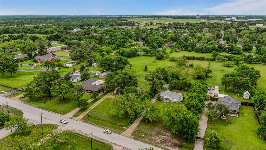 914 Griffith Avenue Terrell, TX 75160 - Photo 29 of 32 an aerial view of residential houses with outdoor space and trees