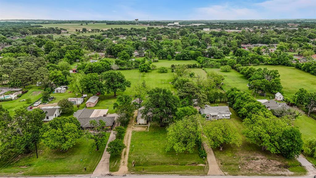 914 Griffith Avenue Terrell, TX 75160 - Photo 5 of 32 an aerial view of a residential houses with outdoor space and trees all around