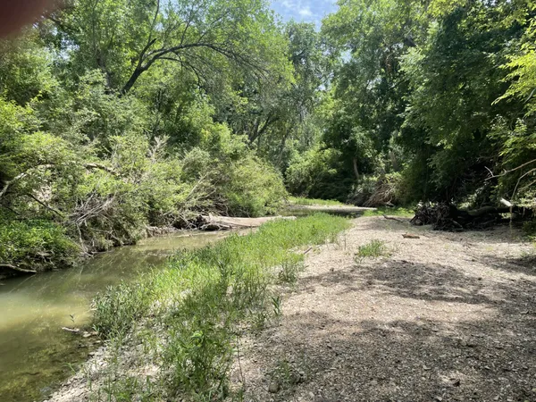 a view of a lake with a yard