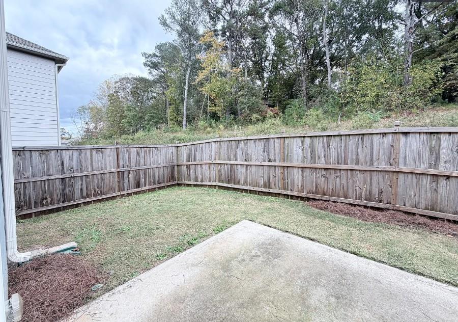 140 Golden Eagle Parkway Braselton, GA 30517 - Photo 12 of 13 a view of backyard with wooden fence