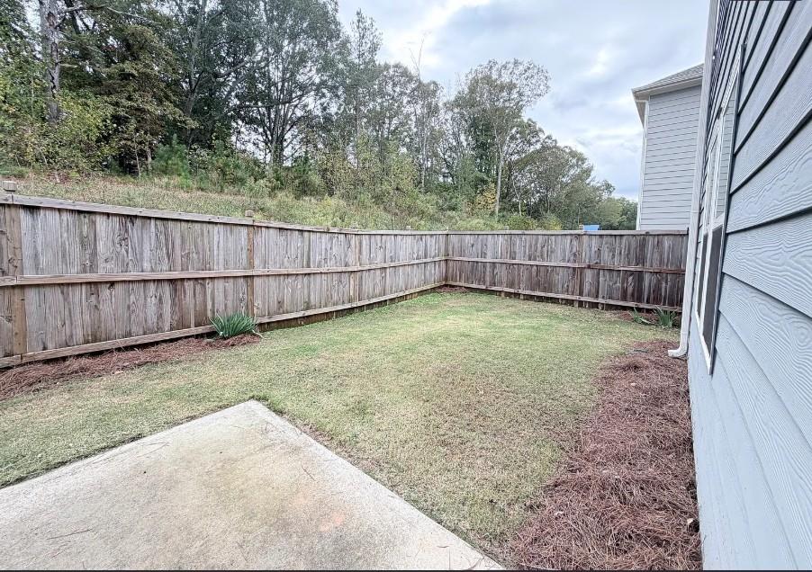 140 Golden Eagle Parkway Braselton, GA 30517 - Photo 13 of 13 a view of a backyard with a wooden fence