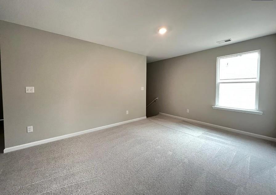140 Golden Eagle Parkway Braselton, GA 30517 - Photo 3 of 13 a view of an empty room with a window