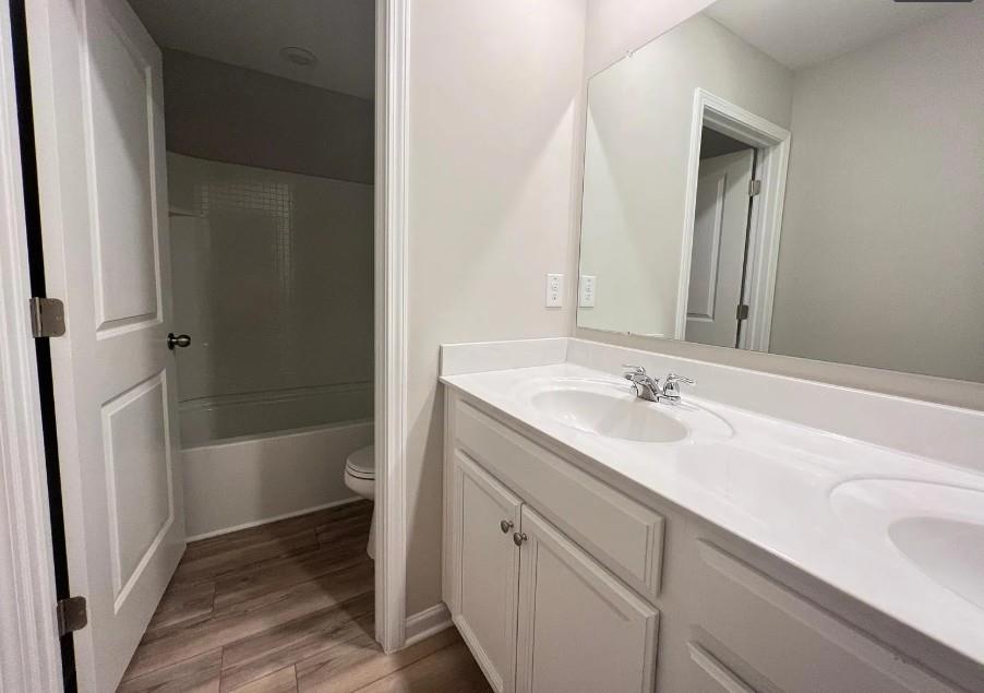 140 Golden Eagle Parkway Braselton, GA 30517 - Photo 6 of 13 a bathroom with a sink a toilet and shower