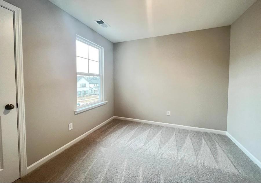 140 Golden Eagle Parkway Braselton, GA 30517 - Photo 7 of 13 an empty room with a window