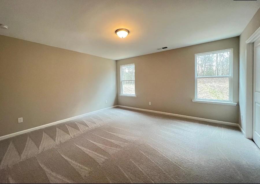 140 Golden Eagle Parkway Braselton, GA 30517 - Photo 10 of 13 a view of an empty room with a window