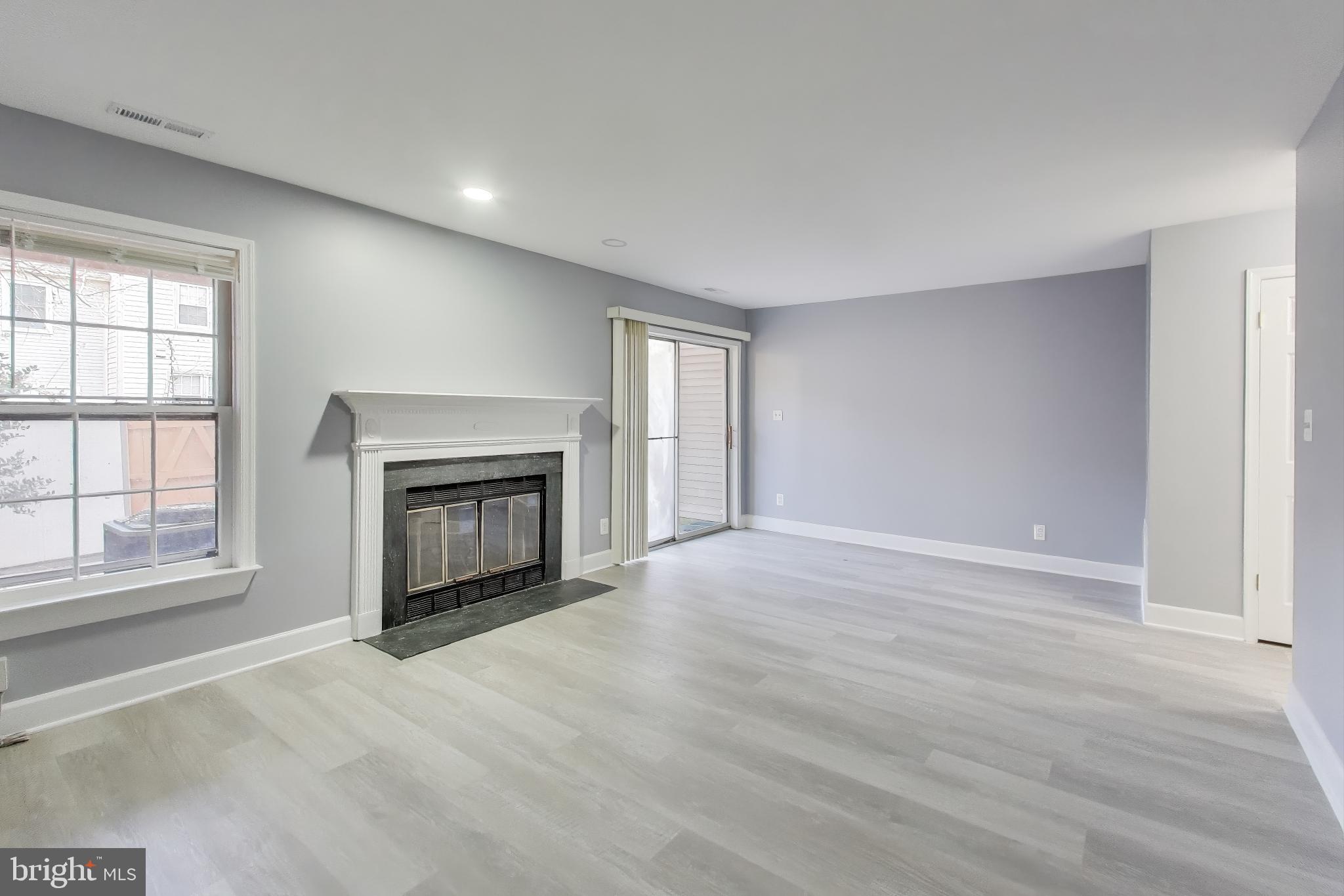 2851 Strauss Terrace Silver Spring, MD 20904 - Photo 25 of 34 an empty room with windows and fireplace