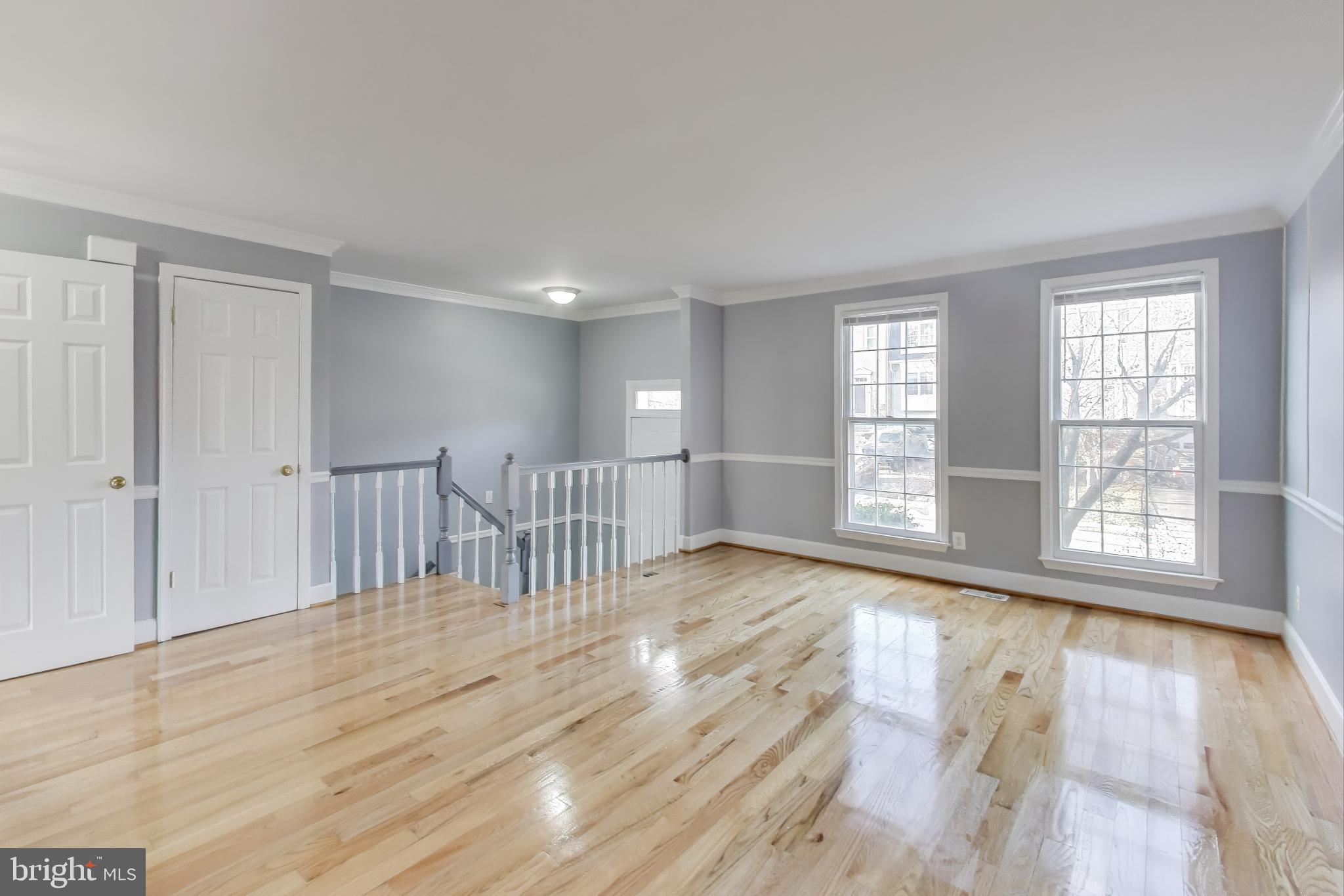 2851 Strauss Terrace Silver Spring, MD 20904 - Photo 4 of 34 a view of an empty room with wooden floor and a window