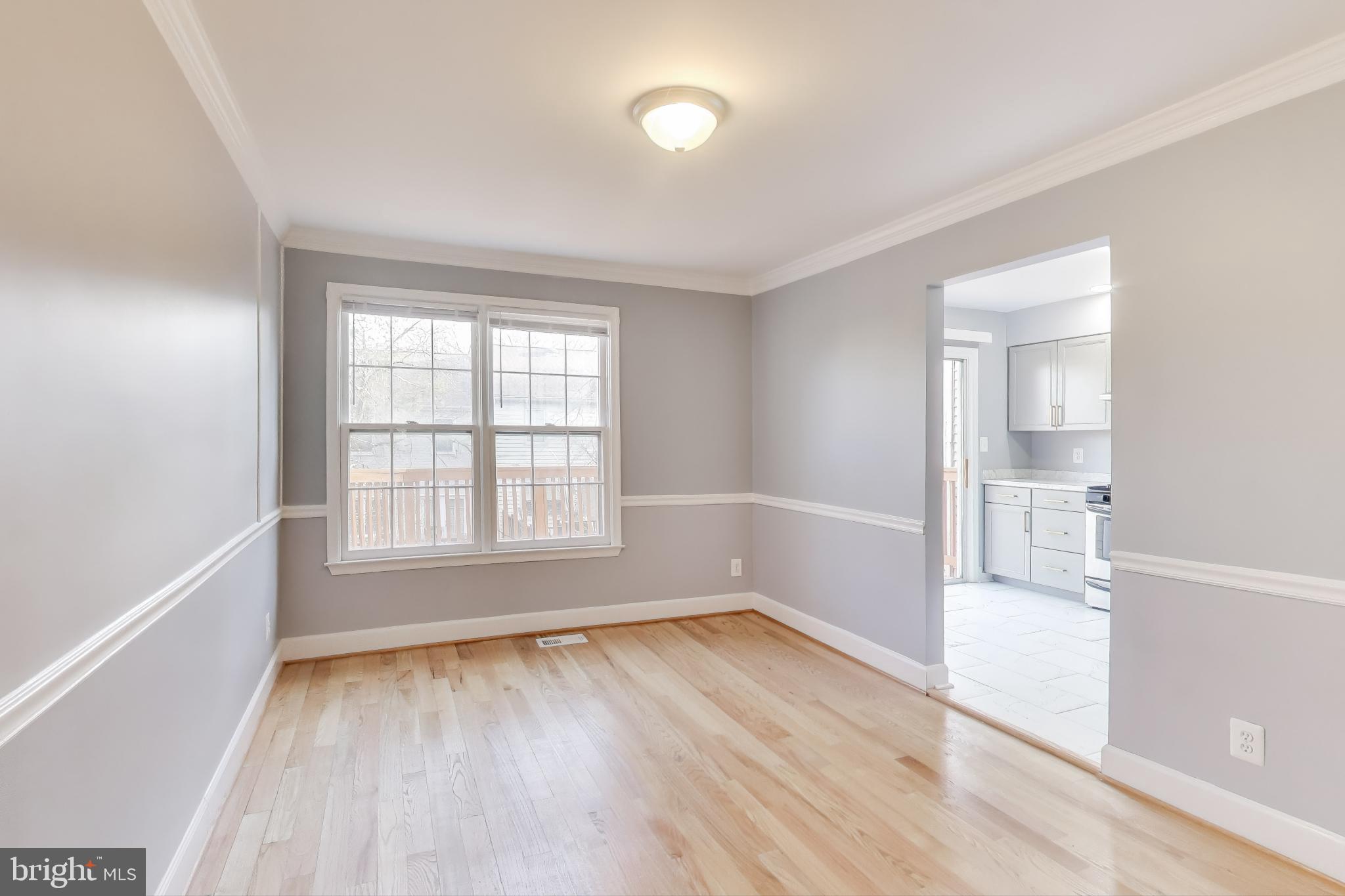 2851 Strauss Terrace Silver Spring, MD 20904 - Photo 6 of 34 an empty room with wooden floor and windows