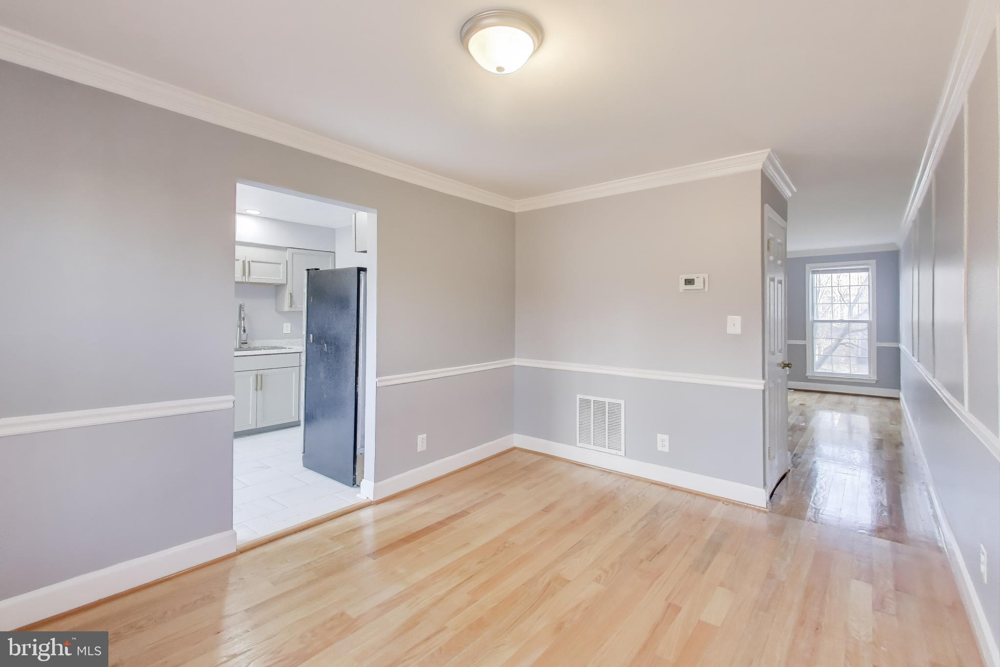 2851 Strauss Terrace Silver Spring, MD 20904 - Photo 7 of 34 wooden floor in an empty room with a window