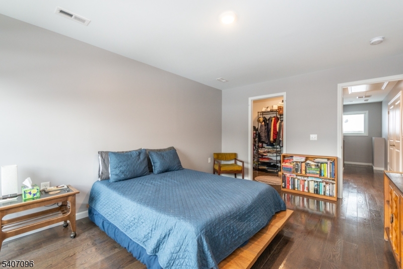 165 Lakeside Road West Milford, NJ 07421 - Photo 14 of 25 a bedroom with a bed and wooden floor