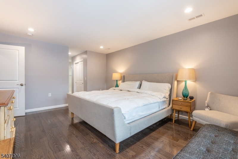 165 Lakeside Road West Milford, NJ 07421 - Photo 18 of 25 a spacious bedroom with a bed and a couch