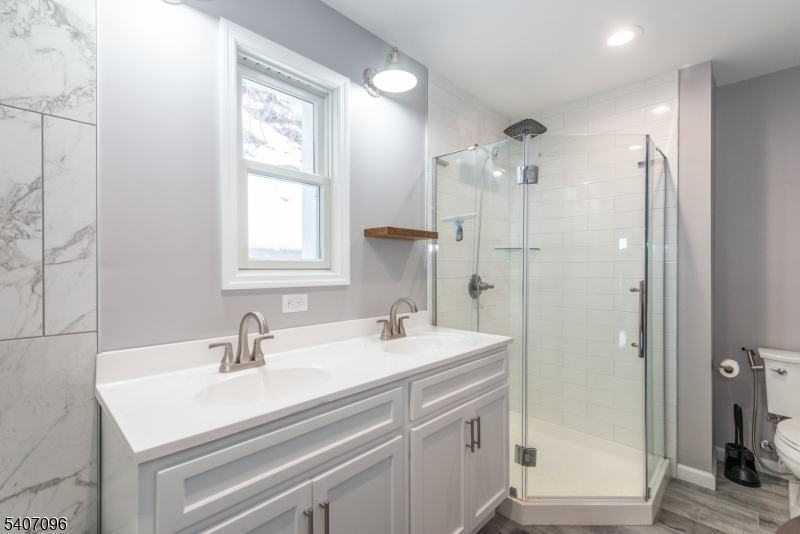 165 Lakeside Road West Milford, NJ 07421 - Photo 20 of 25 a bathroom with a sink double vanity and shower