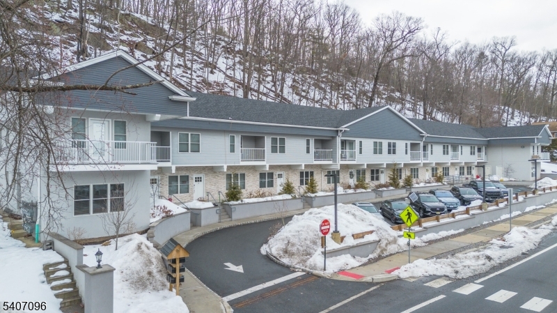 165 Lakeside Road West Milford, NJ 07421 - Photo 22 of 25 a front view of a house with porch and sitting area