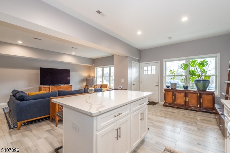 165 Lakeside Road West Milford, NJ 07421 - Photo 5 of 25 a view of living room kitchen with stainless steel appliances kitchen island granite countertop furniture and a flat screen tv