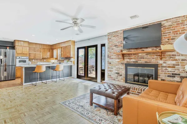 a living room with furniture and a fireplace
