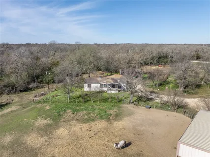 an aerial view of residential house and outdoor space