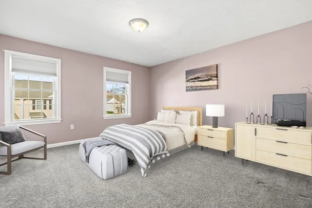 a spacious bedroom with two beds and a couch