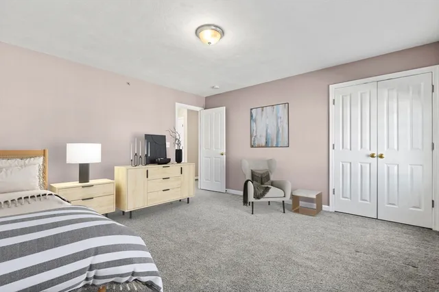 a room with a bed and a chair