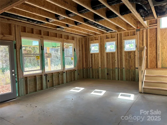 a view of a room with large windows
