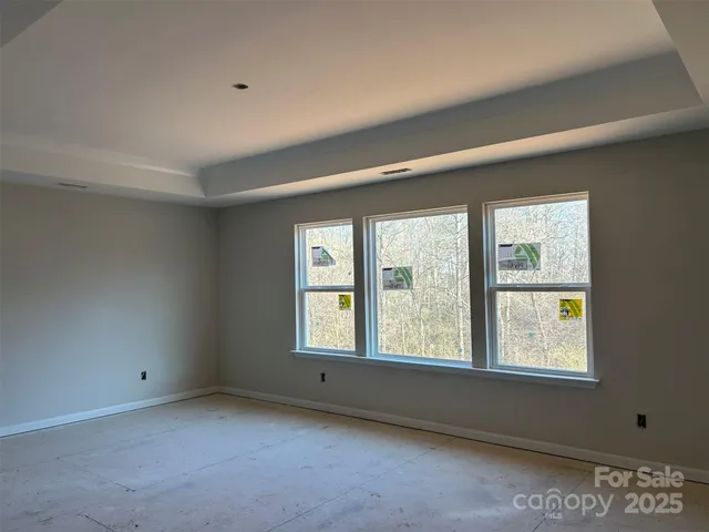 a bedroom with a large bed and a couch