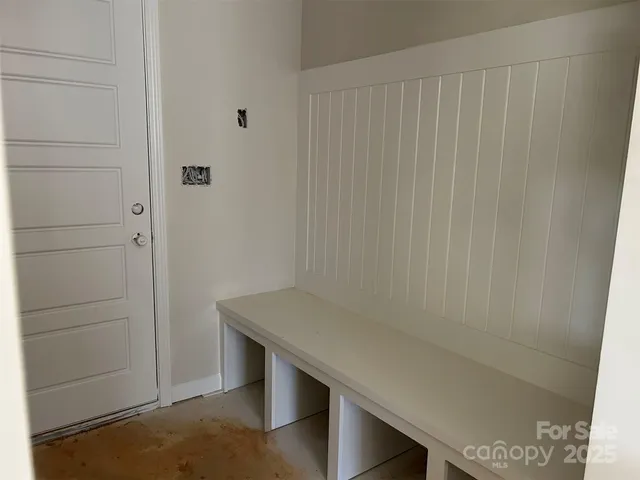 a room with a table and a mirror