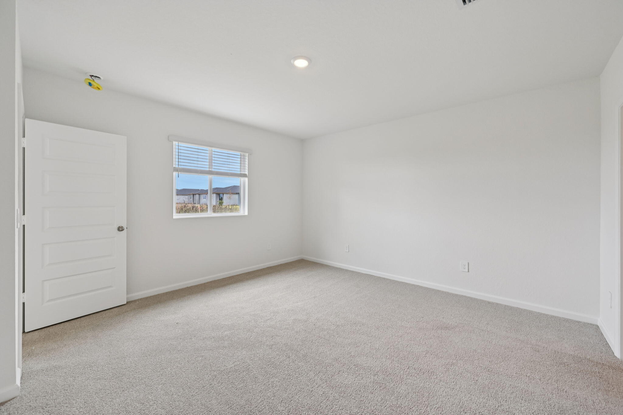 14211 Southwest New Dawn Road Indiantown, FL 34956 - Photo 15 of 37 an empty room with a window