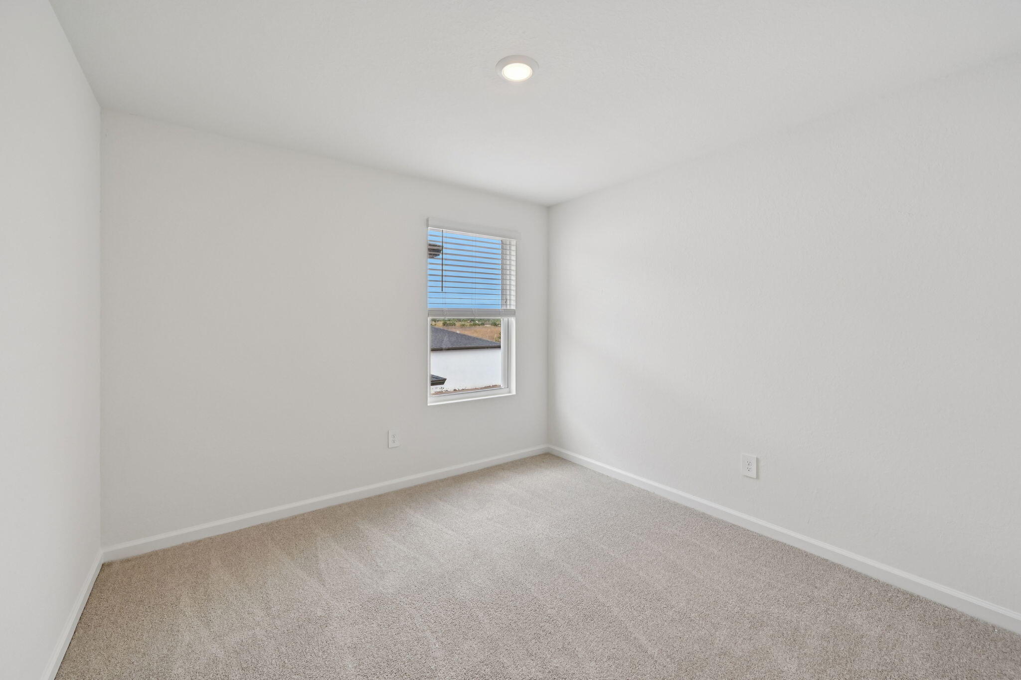 14211 Southwest New Dawn Road Indiantown, FL 34956 - Photo 24 of 37 a view of an empty room and a window