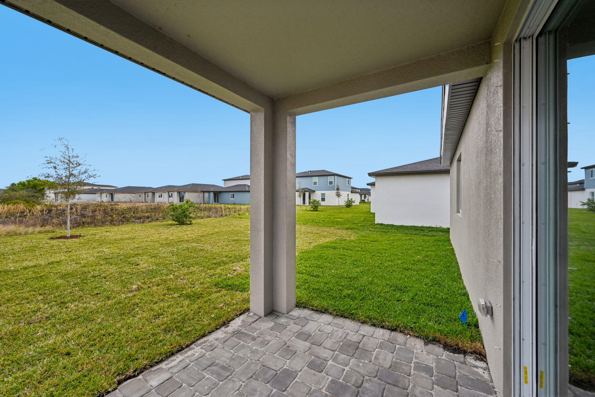 14211 Southwest New Dawn Road Indiantown, FL 34956 - Photo 29 of 37 a view of a back yard from a balcony