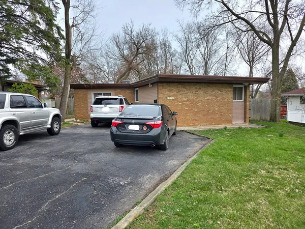a house view with a car park