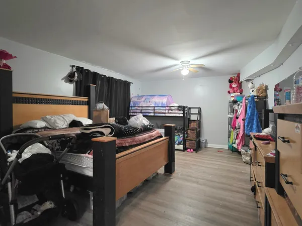 a view of a workspace with furniture and wooden floor