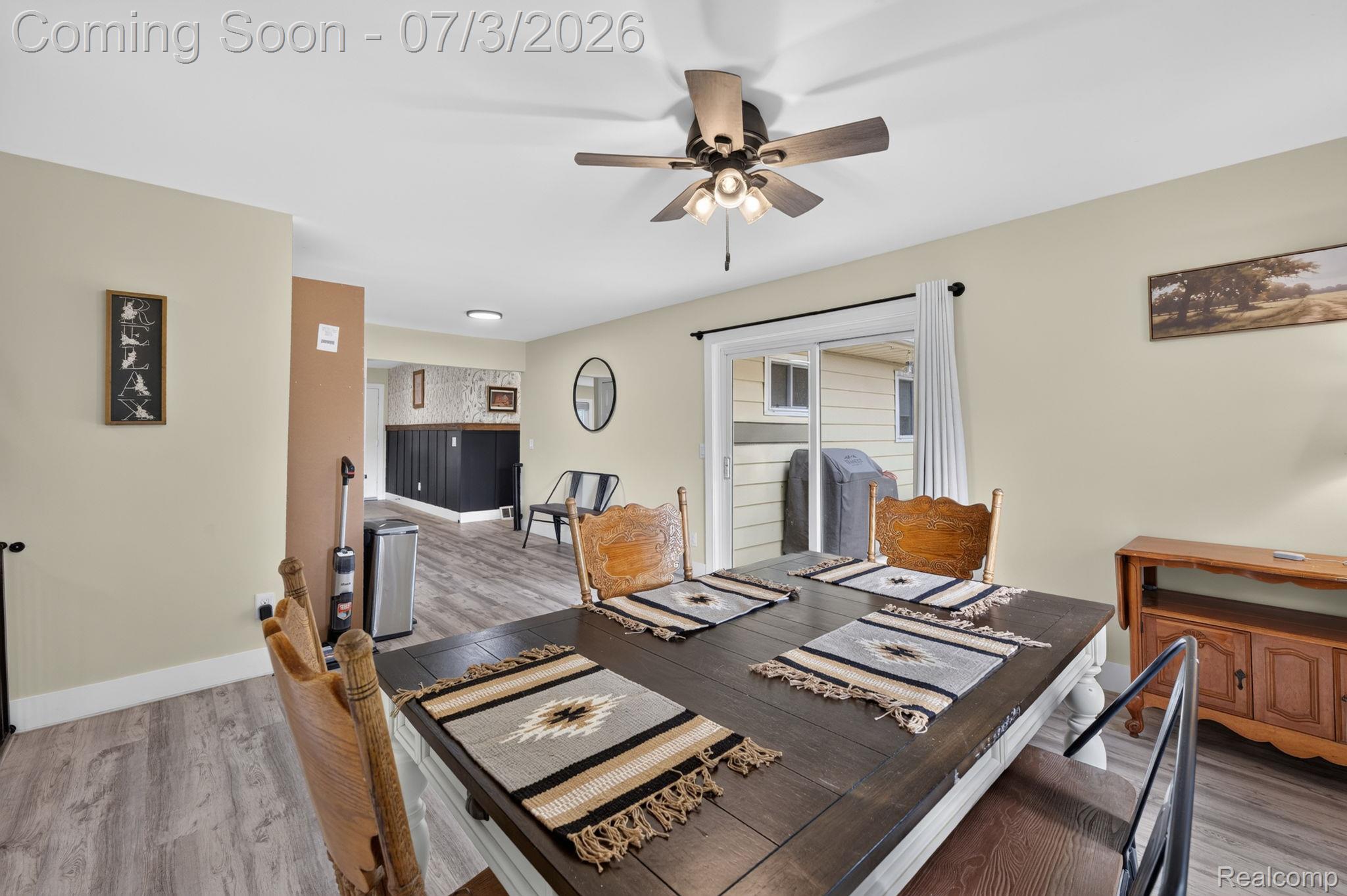 5355 North Seymour Road Flushing, MI 48433 - Photo 17 of 41 Dining area featuring wood-finish flooring and a ceiling fan with integrated lighting