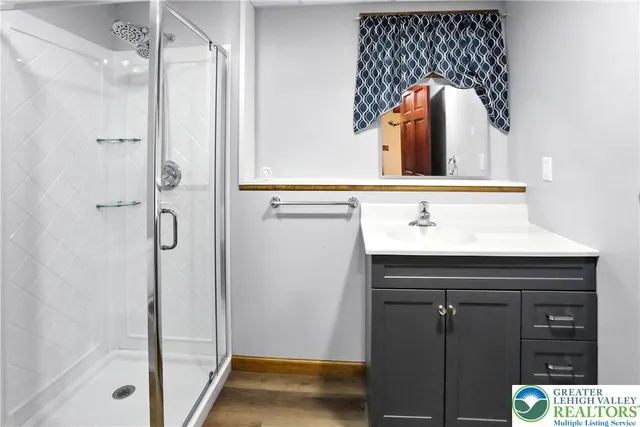 a bathroom with a sink and a mirror