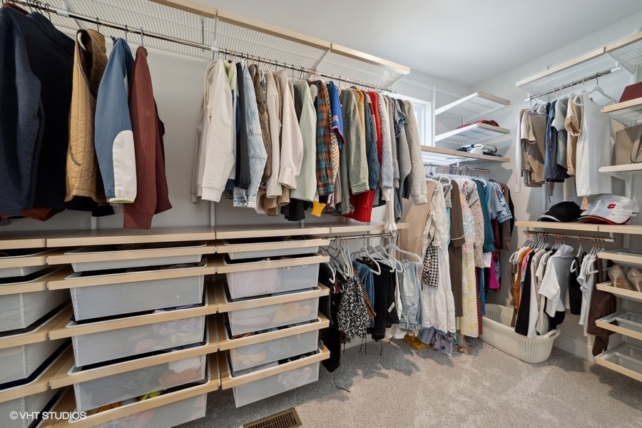780 Treeline Drive Algonquin, IL 60102 - Photo 11 of 24 a view of walk in closet with clothes and shoes