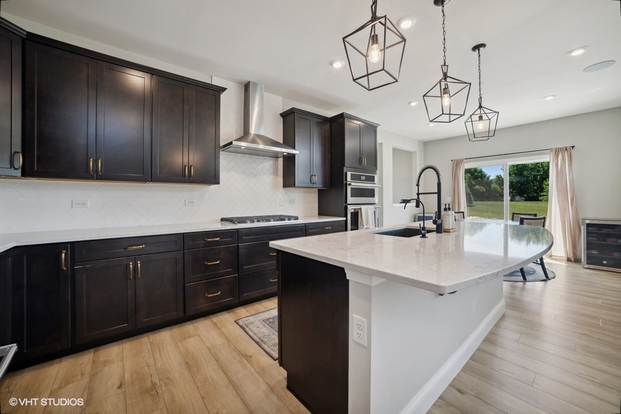 780 Treeline Drive Algonquin, IL 60102 - Photo 20 of 24 a kitchen with wooden cabinets and sink