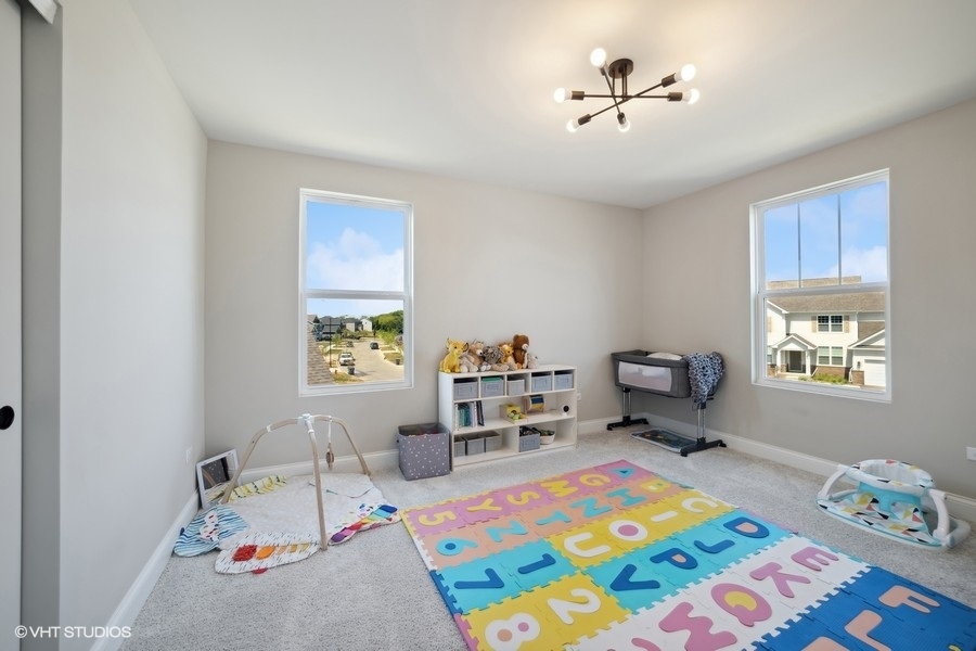 780 Treeline Drive Algonquin, IL 60102 - Photo 22 of 24 a bed room with furniture and a window