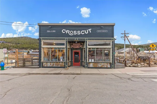 a view of a house with large windows